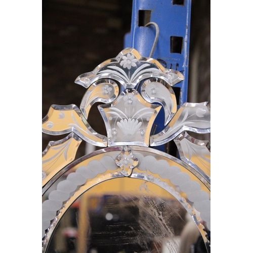 887 - AN ENGRAVED VENETIAN STYLE WALL MIRROR