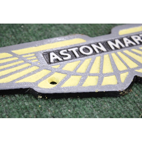 957 - A CAST ASTON MARTIN SIGN, LENGTH 34CM