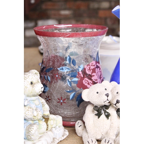 1029 - A VINTAGE BLUE ART GLASS VASE WITH EMBOSSED FLORAL DECORATION AND FLUTED RIM, TEDDY FIGURES, ETC,