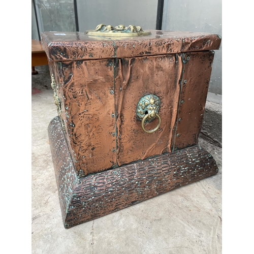 1509 - AN ARTS AND CRAFTS COPPER COVERED COAL BOX WITH LINER AND BRASS PLAQUE AND HANDLES