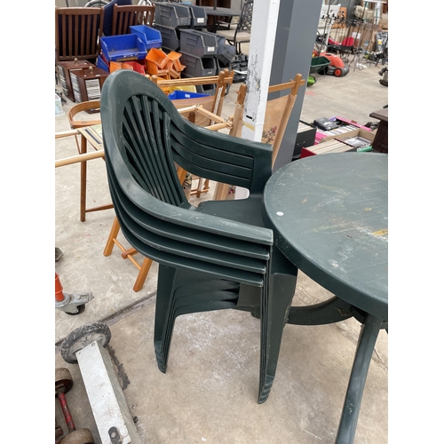 1917 - A GREEN PLASTIC GARDEN TABLE AND FOUR STACKING CHAIRS