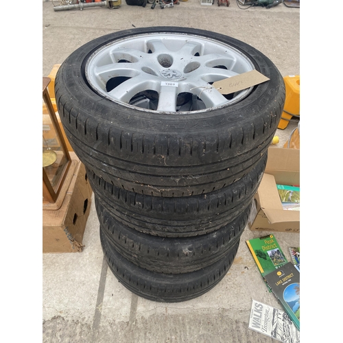 1963 - A SET OF FOUR PEUGEOT WHEELS WITH 185/55R15 TYRES