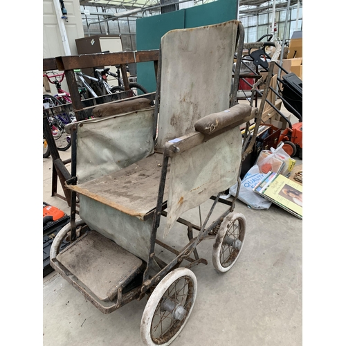 2036 - A VINTAGE METAL AND WOODEN FOLDING WHEELCHAIR