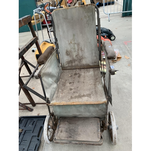 2036 - A VINTAGE METAL AND WOODEN FOLDING WHEELCHAIR