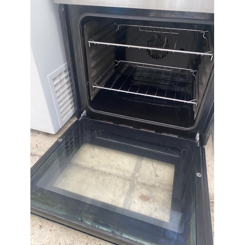 2310 - A SILVER AND BLACK INTERGRATED OVEN AND GRILL