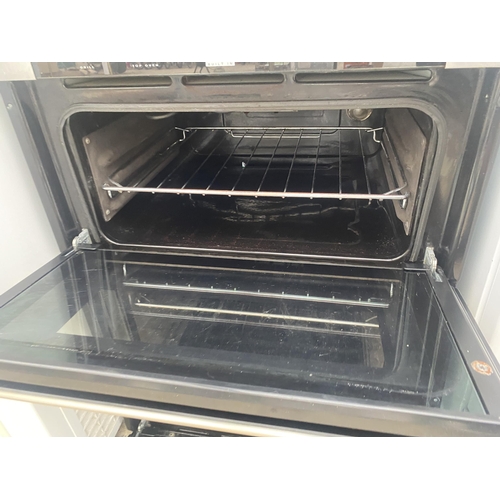 2310 - A SILVER AND BLACK INTERGRATED OVEN AND GRILL