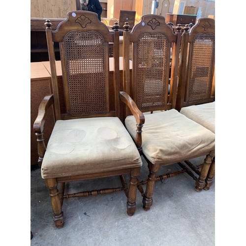 2557 - A SET OF SIX AMERICAN STYLE HARDWOOD DINING CHAIRS WITH SPLIT CANE BACKS, TWO BEING CARVERS