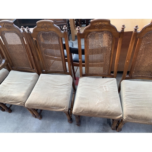 2557 - A SET OF SIX AMERICAN STYLE HARDWOOD DINING CHAIRS WITH SPLIT CANE BACKS, TWO BEING CARVERS