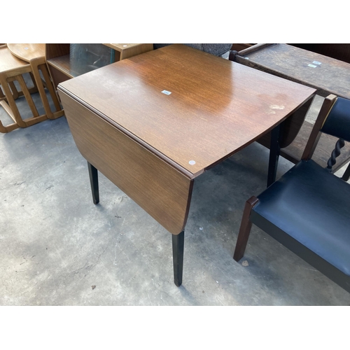 2789 - A RETRO TEAK DROP LEAF DINING TABLE ON BLACK LEGS, 54