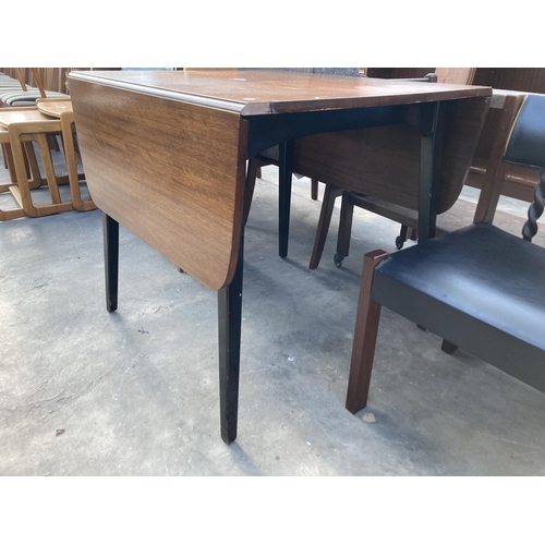 2789 - A RETRO TEAK DROP LEAF DINING TABLE ON BLACK LEGS, 54