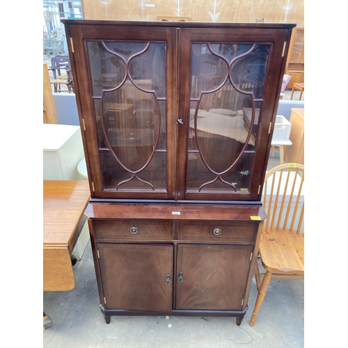 2803 - A MAHOGANY AND INLAID STRONGBOW FURNITURE TWO DOOR BOOKCASE ON BASE, 36