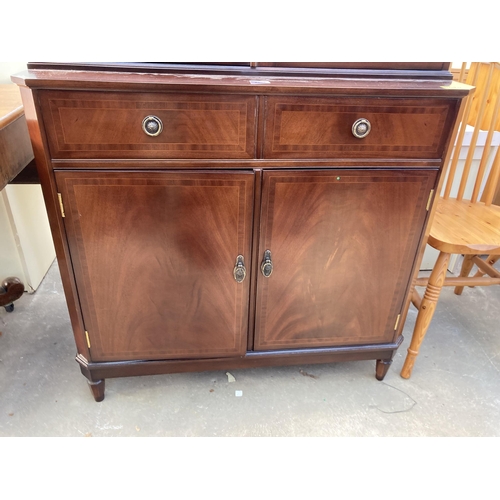 2803 - A MAHOGANY AND INLAID STRONGBOW FURNITURE TWO DOOR BOOKCASE ON BASE, 36