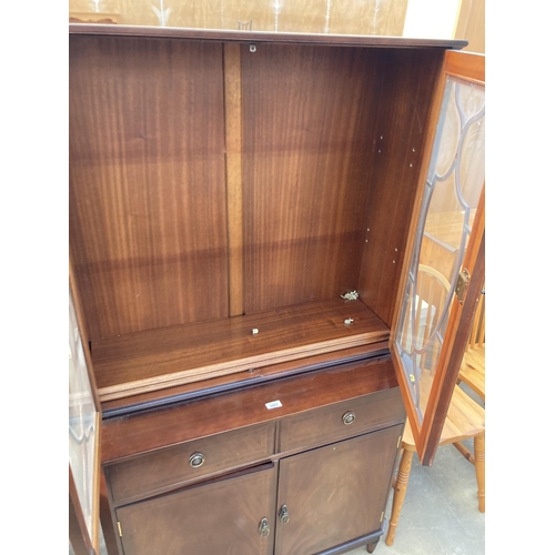 2803 - A MAHOGANY AND INLAID STRONGBOW FURNITURE TWO DOOR BOOKCASE ON BASE, 36