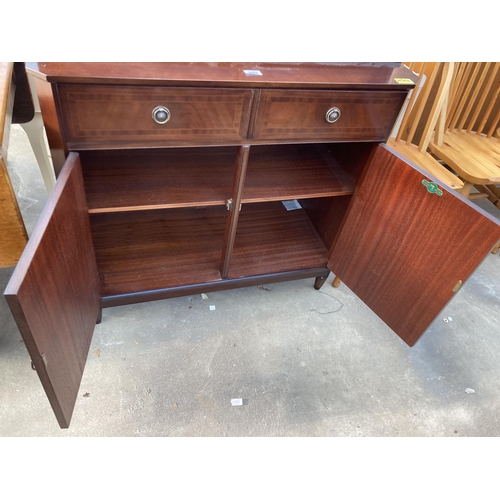 2803 - A MAHOGANY AND INLAID STRONGBOW FURNITURE TWO DOOR BOOKCASE ON BASE, 36