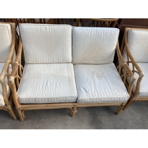 2832 - A BAMBOO AND WICKER THREE PIECE LOUNGE SUITE.