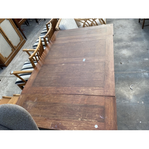 2833 - A MID 20TH CENTURY OAK DRAW LEAF DINING TABLE