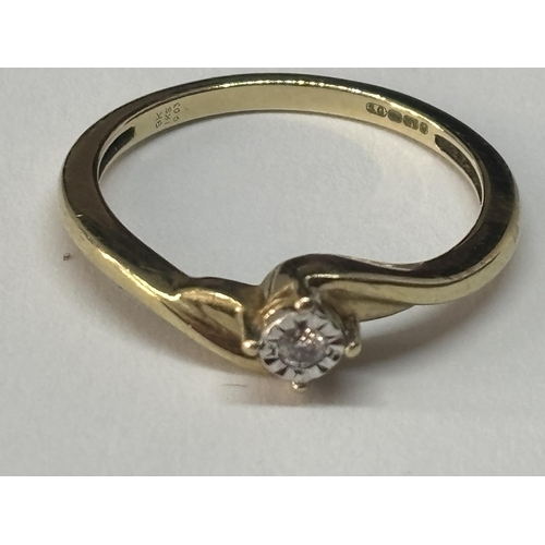 512 - A MARKED 9 CARAT GOLD WITH DIAMONDS TWIST RING