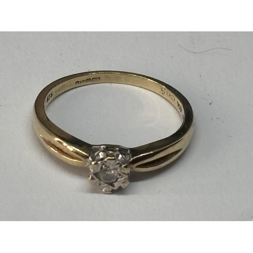 514 - A MARKED 9 CARAT GOLD WITH DIAMOND RING