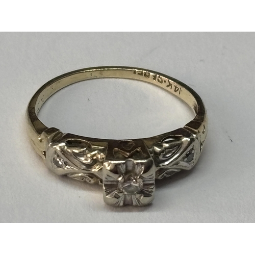 515 - A MARKED 14 CARAT GOLD WITH DIAMOND RING