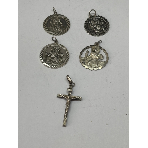 527 - FIVE MARKED SILVER RELIGIOUS PENDANTS