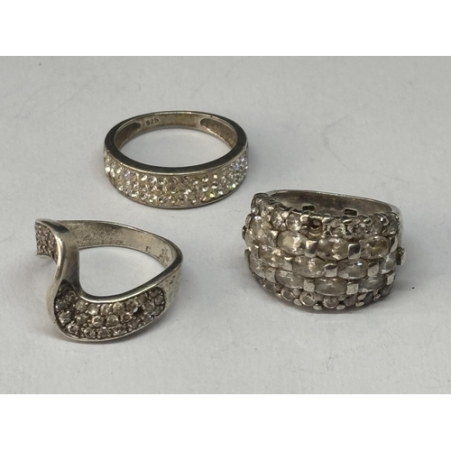 549 - THREE VARIOUS MARKED SILVER RINGS