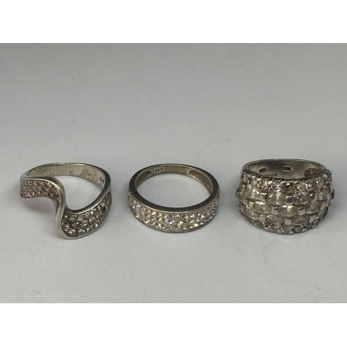 549 - THREE VARIOUS MARKED SILVER RINGS