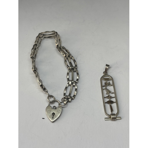 565 - A MARKED SILVER GATE BRACELET WITH HEART PADLOCK AND A SILVER PENDANT