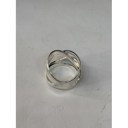 567 - A MARKED SILVER LADIES DRESS RING