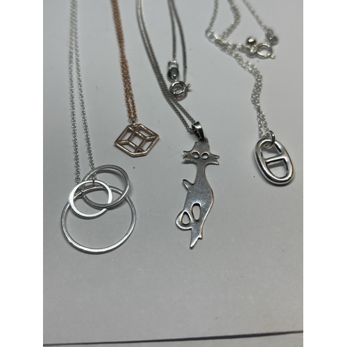 577 - FOUR MARKED SILVER NECKLACES WITH PENDANTS