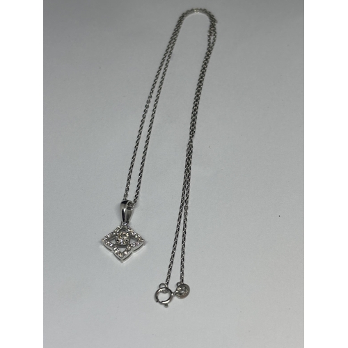 584 - AN 18 CARAT WHITE GOLD PENDANT WITH CHAIN, STUDDED WITH 0.44 CARATS OF ROUND BRILLIANT CUT NATURAL D... 