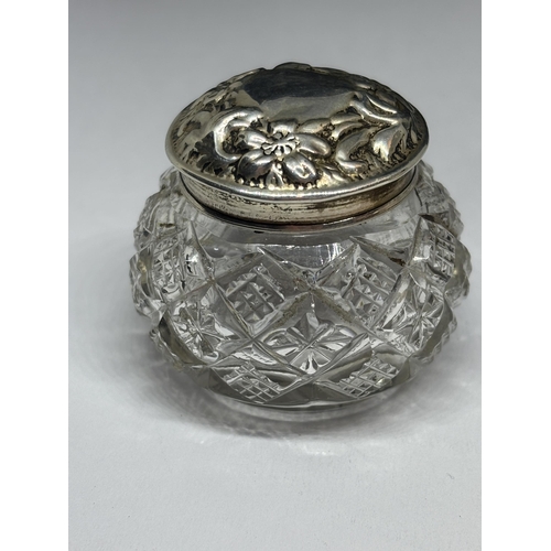 83 - TWO CUT GLASS POTS WITH HALLMARKED SILVER TOPS ONE LONDON THE OTHER BIRMINGHAM