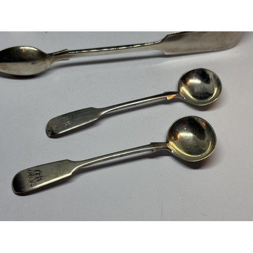 85 - A PAIR OF HALLMARKED EXETER 1869 SILVER TONGS AND TWO 1853 SPOONS GROSS WEIGHT 60.5 GRAMS