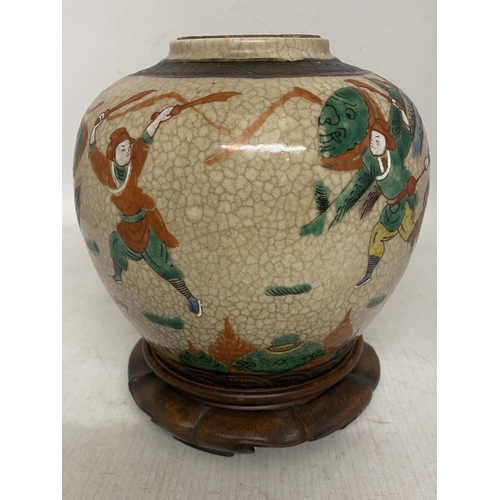 317 - A CHINESE PORCELAIN CRACKLE GLAZE NANKING JAR/TEA CADDY PAINTED WITH WARRIOR FIGURES AND HORSES - IN... 