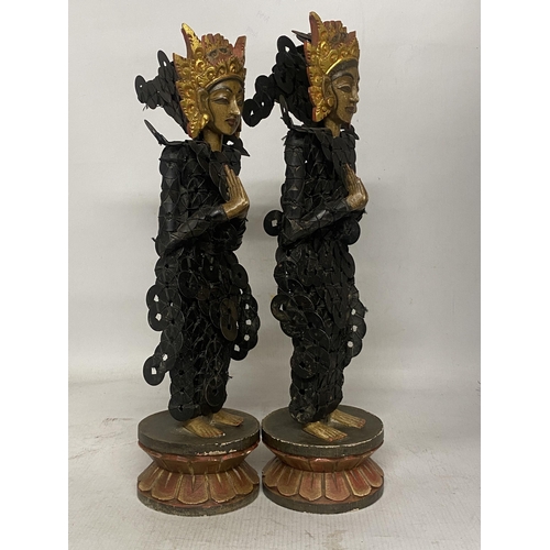 322 - A PAIR OF BALINESE TRIBAL FIGURES ON WOODEN LOTUS THRONES THEIR BODIES CONSTRUCTED FROM CHINESE COIN... 