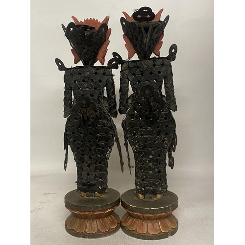 322 - A PAIR OF BALINESE TRIBAL FIGURES ON WOODEN LOTUS THRONES THEIR BODIES CONSTRUCTED FROM CHINESE COIN... 