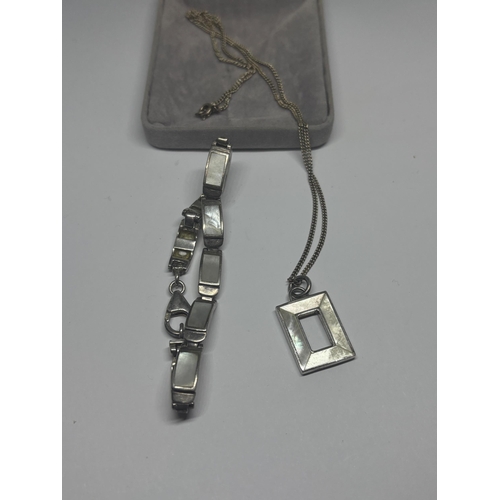 591 - A SILVER AND MOTHER OF PEARL NECKLACE AND BRACELET IN A PRESENTATION BOX