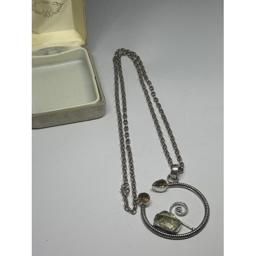 594 - A SILVER DESIGNER NECKLACE WITH ROCK CRYSTAL AND CITRINE PENDANT