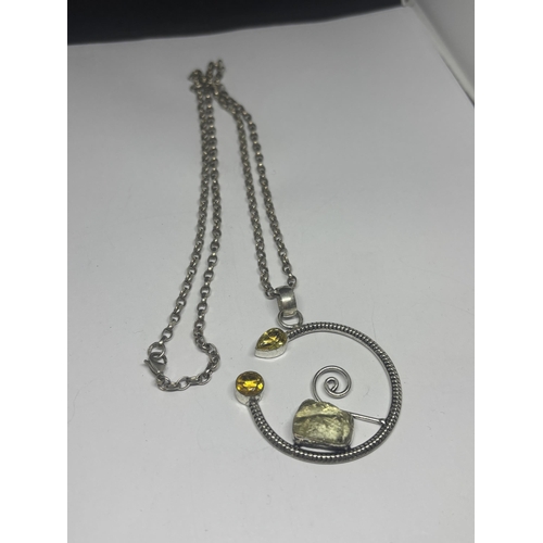 594 - A SILVER DESIGNER NECKLACE WITH ROCK CRYSTAL AND CITRINE PENDANT