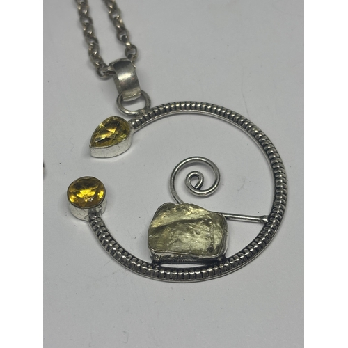 594 - A SILVER DESIGNER NECKLACE WITH ROCK CRYSTAL AND CITRINE PENDANT