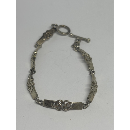 598 - THREE ORNATE SILVER BRACELETS