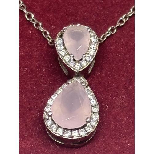 604 - A MARKED SILVER AND PINK AND CLEARSTONE  STONE NECKLACE AND EARRING SET IN A PRESENTATION BOX