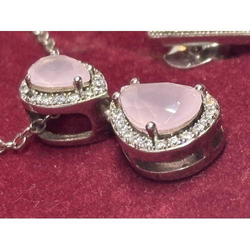 604 - A MARKED SILVER AND PINK AND CLEARSTONE  STONE NECKLACE AND EARRING SET IN A PRESENTATION BOX