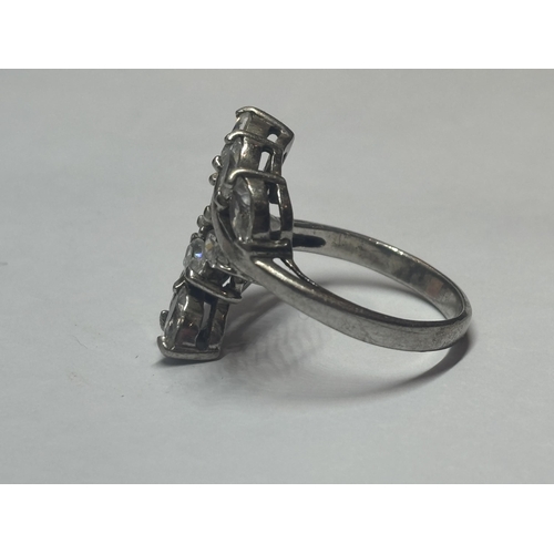 606 - A SILVER DRESS RING WITH CLEAR STONE PETAL DESIGN SIZE R/S IN A PRESENTATION BOX