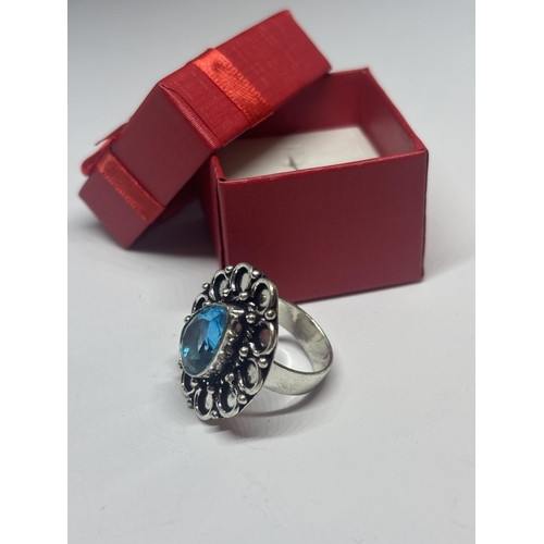 614 - A MARKED 925 SILVER AND BLUE TEARDROP  STONE RING SIZE N/O IN A PRESENTATION BOX