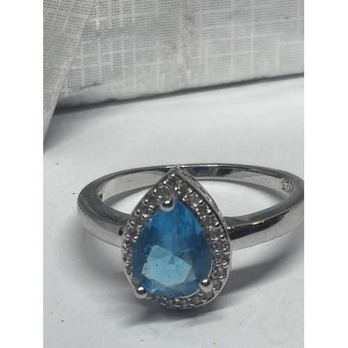 623 - A MARKED 925 SILVER RING WITH A TEARDROP BLUE TOPAZ STONE SIZE P/Q IN A PRESENTATION BOX