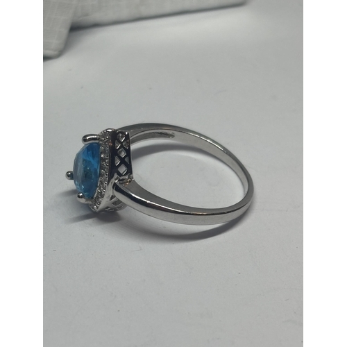 623 - A MARKED 925 SILVER RING WITH A TEARDROP BLUE TOPAZ STONE SIZE P/Q IN A PRESENTATION BOX