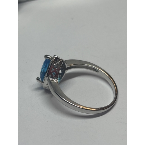 623 - A MARKED 925 SILVER RING WITH A TEARDROP BLUE TOPAZ STONE SIZE P/Q IN A PRESENTATION BOX