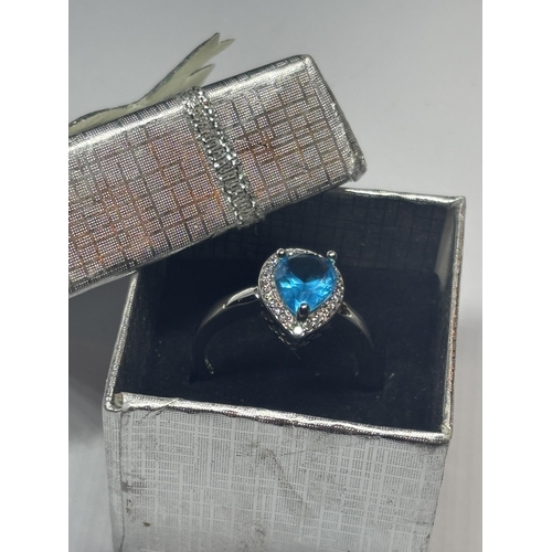 623 - A MARKED 925 SILVER RING WITH A TEARDROP BLUE TOPAZ STONE SIZE P/Q IN A PRESENTATION BOX