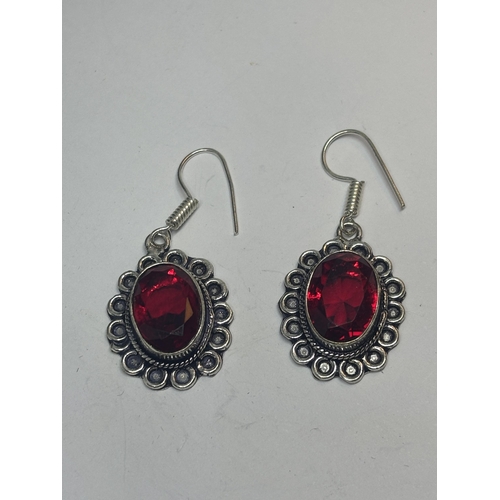 627 - A PAIR OF MARKED 925 SILVER EARRINGS WITH RED STONES IN A PRESENTATION BOX