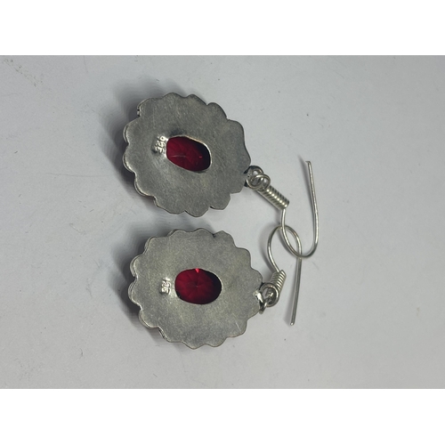 627 - A PAIR OF MARKED 925 SILVER EARRINGS WITH RED STONES IN A PRESENTATION BOX